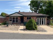 Charming brick home with a well-maintained front yard and mature landscaping at 10440 Gilpin St, Northglenn, CO 80233