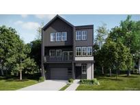 Modern two-story home with large windows, sleek design, and well-manicured landscaping at 7321 Waterleaf Trl, Littleton, CO 80125