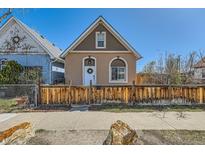 Charming home featuring a cozy exterior with a well-maintained yard and quaint wooden fence at 4648 Josephine St, Denver, CO 80216