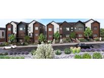 Modern townhomes with mixed brick and siding exterior, charming landscaping, and individual balconies at 4 Ascent Trl, Englewood, CO 80112