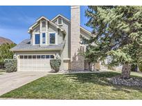 Charming two-story home featuring a two-car garage and well-maintained landscaping at 9724 Iris St, Broomfield, CO 80021
