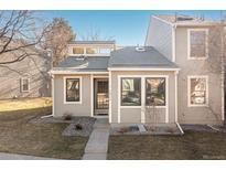 Charming townhome featuring a well-manicured lawn and neutral exterior paint at 4694 S Fraser Ct # A, Aurora, CO 80015