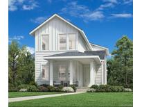 Inviting two-story home featuring white siding, a covered porch, and professionally landscaped front yard at 918 Promenade Dr, Superior, CO 80027