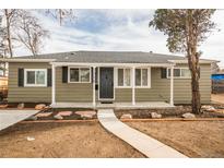 Charming single-story home with a welcoming front porch, landscaped yard, and inviting walkway at 1150 S Taos Way, Denver, CO 80223