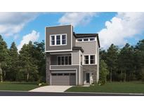Modern three-story home with stone accents, gray siding, and a two-car garage on a tree-lined lot at 9153 White Ridge Rd, Englewood, CO 80112
