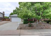 Charming single-Gathering home features a lush front yard and attached two-car garage at 10883 Otis Cir, Westminster, CO 80020