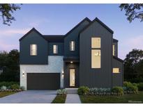 Striking new construction home with modern design, dark siding, stone accents, and lush landscaping at 11324 Alla Breve Cir, Lone Tree, CO 80134