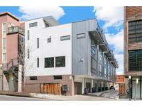 Modern multi-unit building with sleek design and attached garages at 3026 Zuni St, Denver, CO 80211