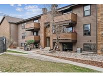 Inviting multi-story condo featuring private balconies, attractive landscaping, and a charming exterior at 203 Wright St # 102, Lakewood, CO 80228