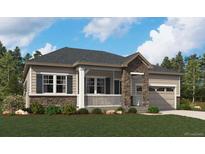 Charming single-story home with stone accents, covered porch, and well-maintained landscaping at 2610 Bitterroot Pl, Highlands Ranch, CO 80129