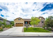 Charming home with a well-manicured lawn, attractive siding, and a welcoming front porch at 3855 Old Oaks St, Castle Rock, CO 80104