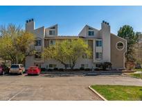 A three-story condominium building with unique architectural design and well-maintained landscaping at 4070 S Atchison Way # 203, Aurora, CO 80014