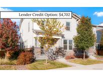 Charming two-story home with a landscaped front yard, stone accents, and lender credit option at 6041 N Orleans St, Aurora, CO 80019
