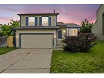 Charming two-story home with a well-manicured lawn, two-car garage, and beautiful exterior paint at 250 Cypress Ln, Broomfield, CO 80020