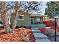 Charming home with a well-manicured front yard and inviting curb appeal at 4520 S Delaware St, Englewood, CO 80110