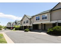 Townhome exteriors feature neutral paint, green roofs, and well-maintained landscaping at 2162 Concord Ln, Superior, CO 80027