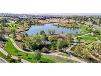 An aerial view of the community pond and walking paths; the perfect place to enjoy an evening stroll at 16224 Cirque Mountain Way, Broomfield, CO 80023