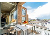 Cozy balcony with seating and a view of the city skyline at 2100 16Th St # 606, Denver, CO 80202