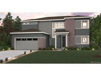 Two story home featuring gray siding, brick accents, an attached garage, and a well manicured lawn at 2560 Lupton Ln, Lafayette, CO 80026