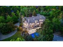 Stunning aerial view of a luxurious estate with lush landscaping, pool, and expansive outdoor deck at 5390 S Boston St, Greenwood Village, CO 80111