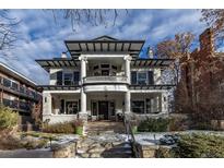 Grand two-story home with classic columns and a welcoming front porch at 750 N Clarkson St, Denver, CO 80218