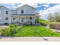 Charming home with curb appeal, featuring well-maintained landscaping and a welcoming entrance at 6260 Everett Ct # D, Arvada, CO 80004