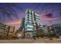 Beautiful exterior of modern high-rise condominium building with glass facade and striking architectural design at 1700 Bassett St # 802, Denver, CO 80202