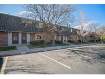 Brick townhomes offer assigned parking, mature trees, and well maintained landscaping at 15107 E Wesley Ave, Aurora, CO 80014