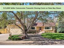 Charming single-Gathering home with well-maintained lawn and mature trees in a quiet neighborhood at 14072 W Alaska Dr, Lakewood, CO 80228