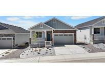 Charming single-Gathering home with stone accents, a two-car garage, and landscaping at 2143 Peralta Loop, Castle Rock, CO 80104