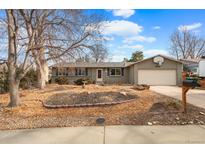 Charming single-story home featuring a two-car garage and a well-maintained front yard at 3280 S Ouray Way, Aurora, CO 80013