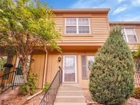 Inviting townhome exterior with well-maintained landscaping and a charming entrance at 2627 E Nichols Cir, Centennial, CO 80122