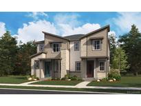Modern two-story townhome with a mix of siding, stone accents, and professionally landscaped front yard at 17105 E Alameda Pkwy, Aurora, CO 80017
