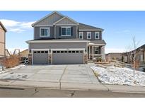 Charming two-story home featuring a two car garage and well-maintained landscaping and grey and white trim at 2924 Echo Park Dr, Castle Rock, CO 80104
