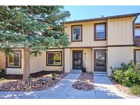Charming townhouse with well-maintained landscaping and inviting front entrance, perfect for a cozy home feel at 16046 E Ithaca Pl # C, Aurora, CO 80013