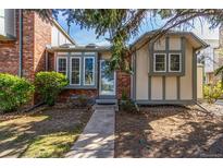 Charming home featuring a brick facade, large windows, and well-maintained landscaping at 3082 W 107Th Pl # H, Westminster, CO 80031