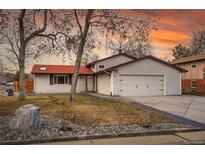 Inviting home with a two-car garage and well-maintained front yard at 903 E 7Th Ave, Broomfield, CO 80020