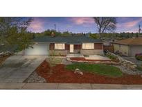 Charming brick home with a well-maintained front yard and inviting curb appeal at 1155 W 4Th Ave, Broomfield, CO 80020