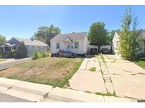 Charming single-story home with a well-maintained front yard and private driveway at 1566 W Nevada Pl, Denver, CO 80223