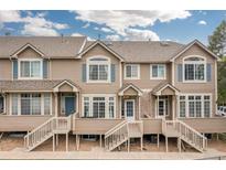 Inviting townhomes featuring private entrances, decks, and attractive landscaping, offering comfortable and stylish living at 5555 E Briarwood Ave # 1404, Centennial, CO 80122
