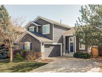 Charming two-story home featuring a well-manicured lawn and a welcoming entrance at 4128 S Riviera St, Aurora, CO 80018