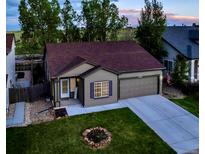 Charming single-story home featuring well-maintained landscaping, a two-car garage, and a cozy front porch at 5428 Suffolk Ave, Castle Rock, CO 80104