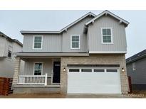 Charming two-story home featuring a modern elevation and two-car garage at 3352 N Buchanan Way, Aurora, CO 80019