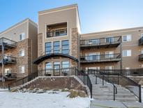 Modern building exterior with stone and metal accents at 6000 W Floyd Ave # 105, Denver, CO 80227