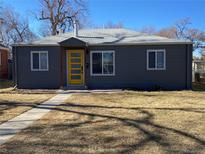 Charming single-story home featuring a new gray exterior and a bright yellow front door at 1263 N Willow St, Denver, CO 80220