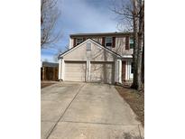 Charming two-story home featuring a two car garage and traditional shutters at 16835 E Harvard Pl, Aurora, CO 80013