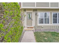 Inviting front entrance with well-maintained landscaping and a decorative door at 14344 E Hawaii Cir # B, Aurora, CO 80012