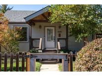 Charming home featuring a covered entryway and well-maintained landscaping, and a white front door with glass inset at 4645 Quitman St, Denver, CO 80212