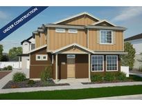 Charming new two-story home featuring a covered entryway and professionally landscaped front yard at 22152 E 38Th Pl, Aurora, CO 80019