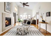 Bright, spacious primary bedroom with fireplace and sitting area at 7551 S Garland St, Littleton, CO 80128